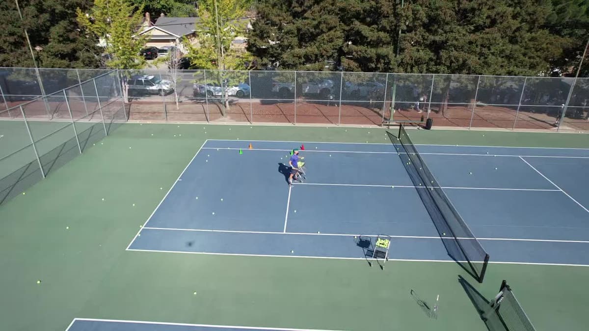 Players on a tennis court seen from above