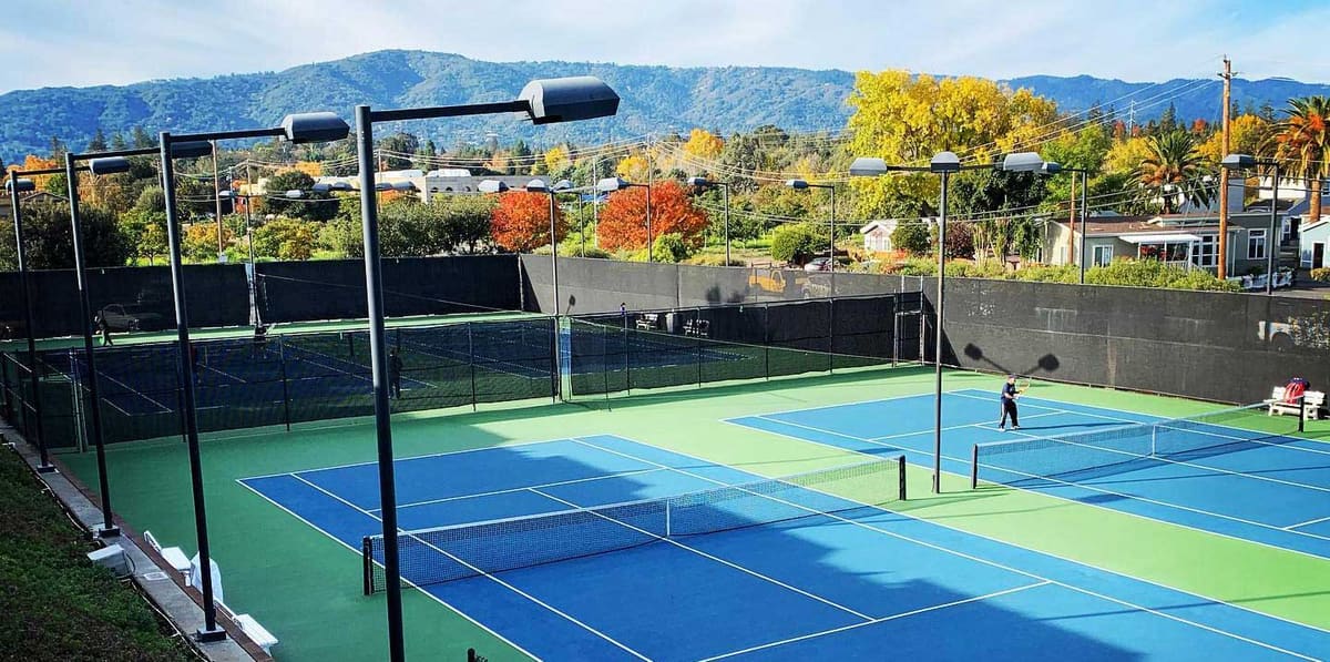 Tennis courts at the club with the hills behind