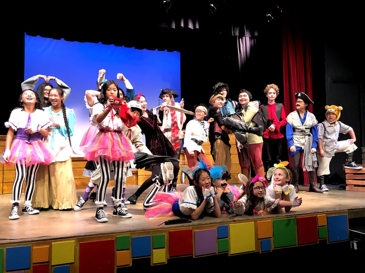 A cast of young actors in costume on the Sierra Madre Playhouse stage